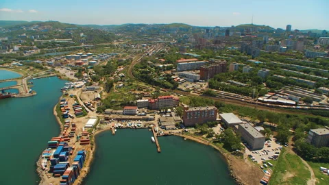 Helicopter ( drone, quadcopter ) flies over the settlement, the sea, the railway Stock Footage 92201145