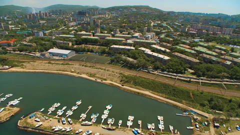 Helicopter ( drone, quadcopter ) flies over a settlement and yacht parking Stock Footage 92201193