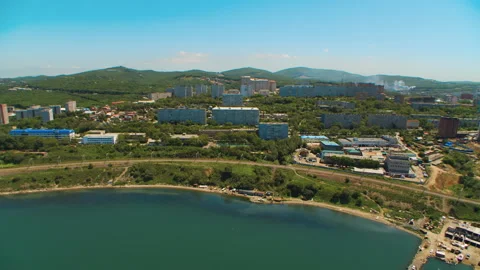 Helicopter ( drone, quadcopter ) flies over a settlement and a railway Stock Footage 92201227