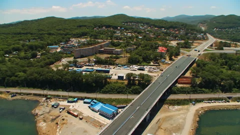Helicopter ( drone, quadcopter ) flies over the settlement, the sea, the railway Stock Footage 92201334