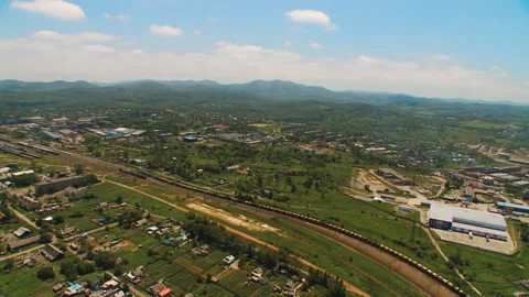 Helicopter ( drone, quadcopter ) flies over the settlement, the railway Stock Footage 92201502