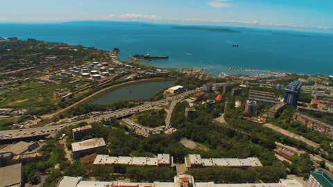 Helicopter ( drone, quadcopter ) flies over the city, the sea, houses Stock Footage 92201706