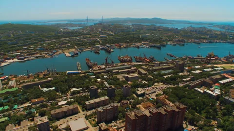 Helicopter ( drone, quadcopter ) flies over the city, the sea, houses  Stock Footage 92201844