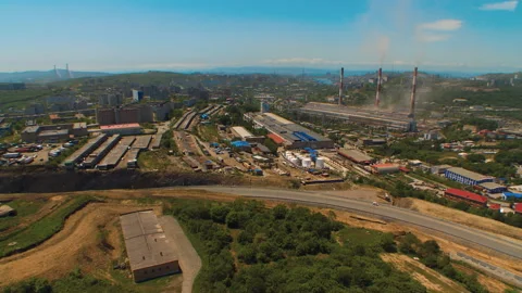 Helicopter ( drone, quadcopter ) flies over the settlement near the sea, road Stock Footage 92201865