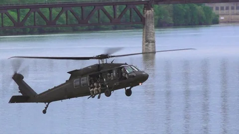 Helicopter dropping frog men Stock Footage 75236555