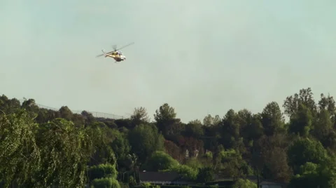 Helicopter dropping water on fire 6 Stock-Footage 54642034