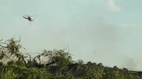 Helicopter dropping water on fire 7 Video stock 54642429