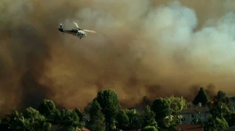 Helicopter dropping water on fire Stock-Footage 54642396