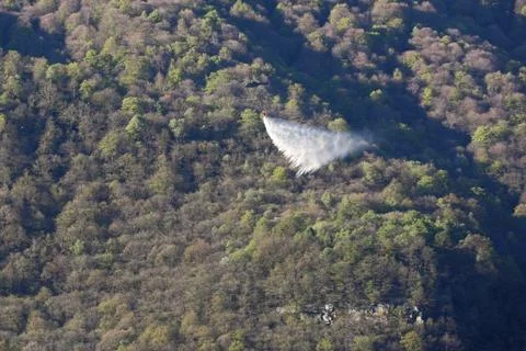 Helicopter dropping water Stock Photos