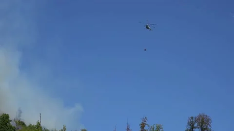 A helicopter drops water Stock Footage 204123287