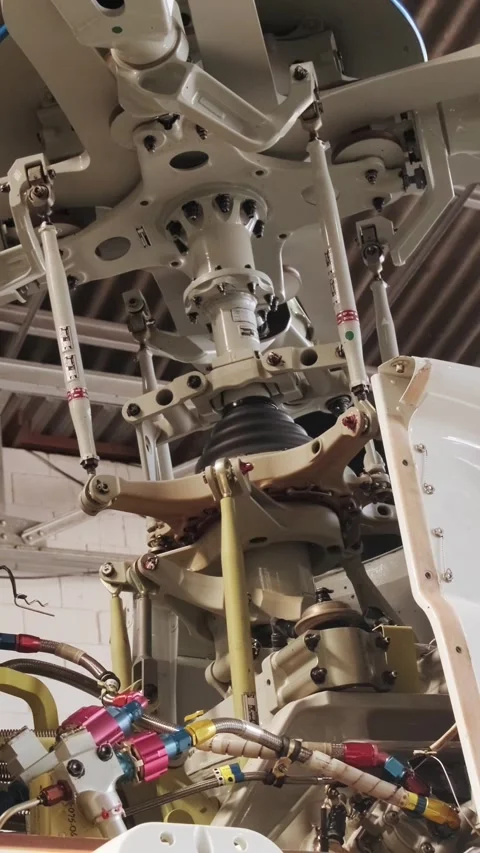 Helicopter Engine and Rotor Hub Exposed During Maintenance and Repair Work Stock Footage 338379084