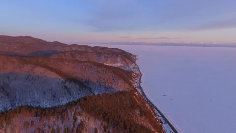 Helicopter epic Siberian winter sunset Trans-Siberian Railway frozen lake Baikal Stock Footage 317963211