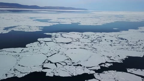 Helicopter epic spring lake Baikal Siberia nature, Giant ice floe glaciers float Stock Footage 202642753