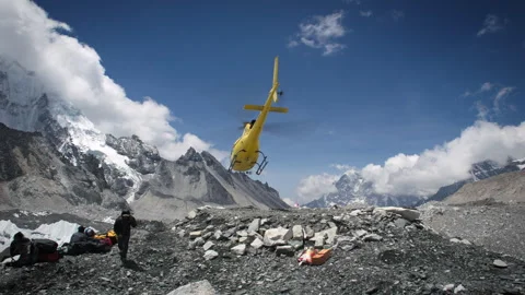 Helicopter evacuation landing at Everest base camp in Nepal Stock Footage 335495331