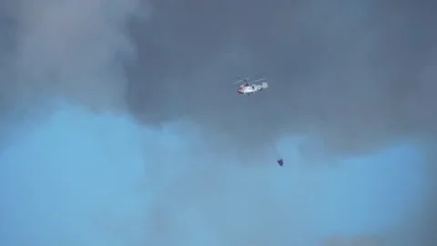 Helicopter fighting forest fire slow motion Stock Footage 281842171