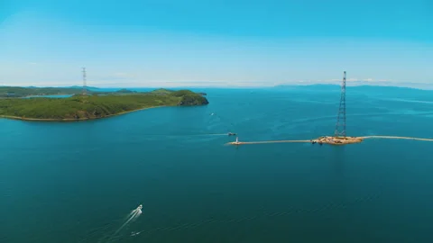 Helicopter flies above the beacon and the tower of the repeater Stock Footage 92201061