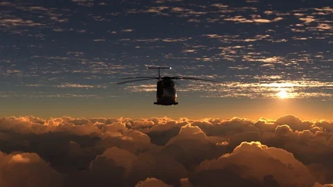 Helicopter flies above the clouds on sunset Stock Footage 116871309