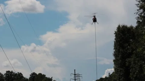 Helicopter flies above the tree line Stock Footage 41455745