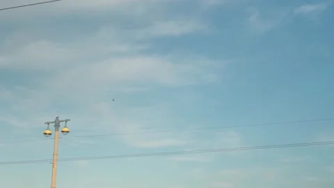 Helicopter flies in the blue sky over the city Stock Footage 157656153