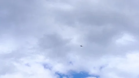 Helicopter flies far in the sky 库存影片 94149772