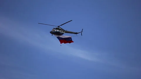 The helicopter flies with the flag of Russia Stock Footage 64569845