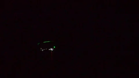 Helicopter flies at night with lights on for training Stock Footage 152796196