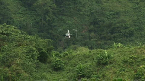 Helicopter flies over camera 3 Stock Footage 520086