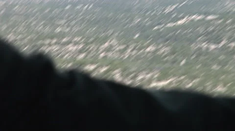 Helicopter flies over desert pull to crew member Stock Footage 45493824