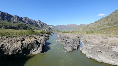 Helicopter flies over the of the mountain river valley Stock Footage 63449745