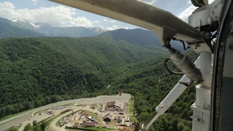 Helicopter flies over the mountains Stock Footage 73104766
