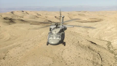 The helicopter flies over Rocky And Sandy Areas. Stock Footage 145955853