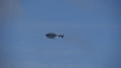 The helicopter flies in the sky Stock Footage 112186391