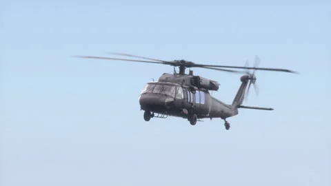 The helicopter flies in the sky. Stock Footage 141659161