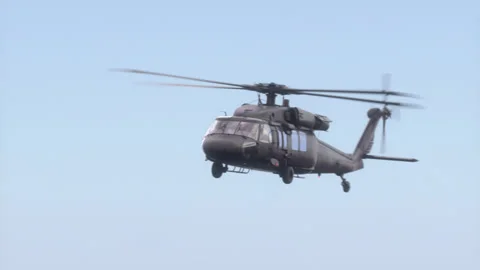 The helicopter flies in the sky. Video stock 141661060