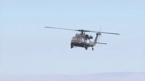 The helicopter flies in the sky. Video stock 142027906