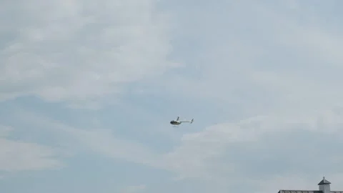 Helicopter flies in the sky Stock Footage 245105400