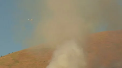 Helicopter flies through fire smoke Stock Footage 21534959