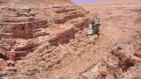 The helicopter flies through the gorge. Stock Footage 142768317