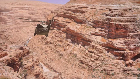 The helicopter flies through the gorge. Stock Footage 142832180