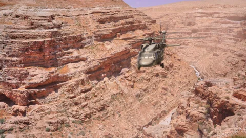 The helicopter flies through the gorge. Stock Footage 143258966