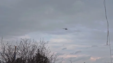 Helicopter flies through the sky Stock Footage 129517721