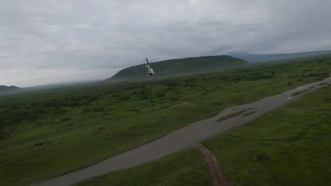 Helicopter flight against the backdrop of nature. Footage. Drone footage of a Vidéo 253730638