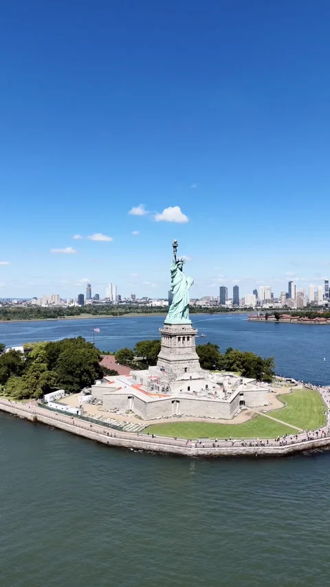 Helicopter flight around the Statue of Liberty with the New York and New Jersey Stock Footage 308434167