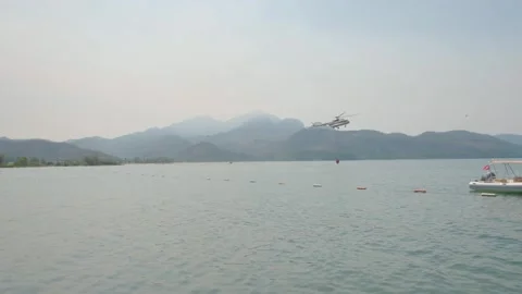 Helicopter in Flight During Firefighting Operations Stock Footage 282928120