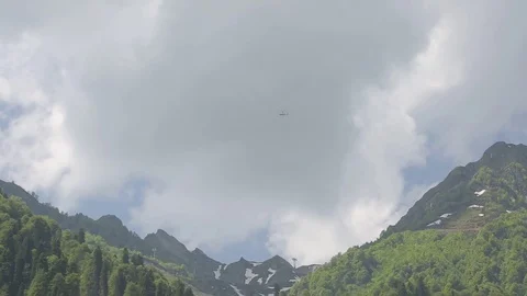 Helicopter in flight, mountains Stock Footage 73306845