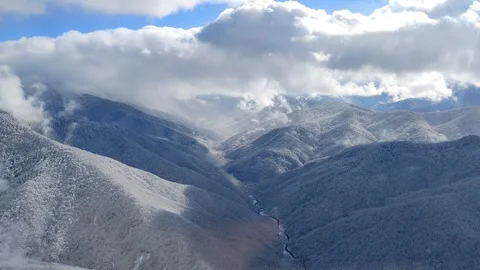 Helicopter flight over Caucasus mountains. Aerial view of beautiful landscape Stock Footage 242562318