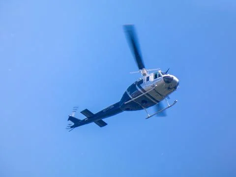 A helicopter in flight Stock Photos