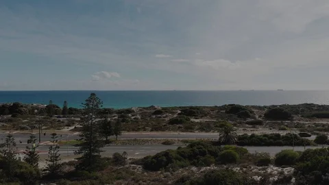 Helicopter fly by beach Stock Footage 128340492