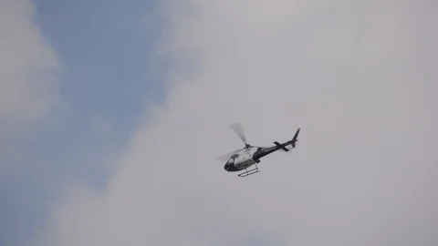 Helicopter flying by 1 Stock Footage 106593351