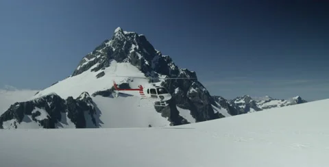 Helicopter flying away from Glacier Stock Footage 64449357